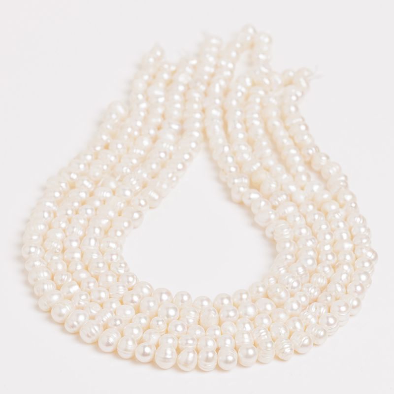 Pietre Semipretioase - Perle de cultura alb oval 6-7 mm - magazinuldepietre.ro
